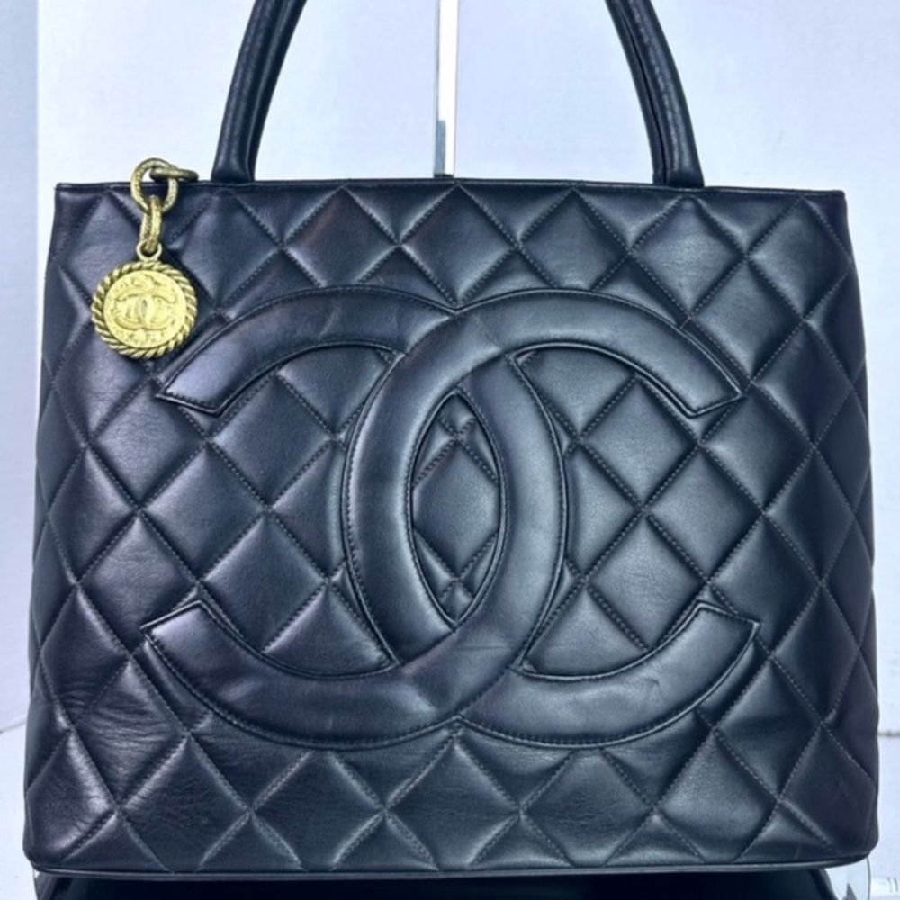 CHANEL Black Quilted Tote with Gold Accent